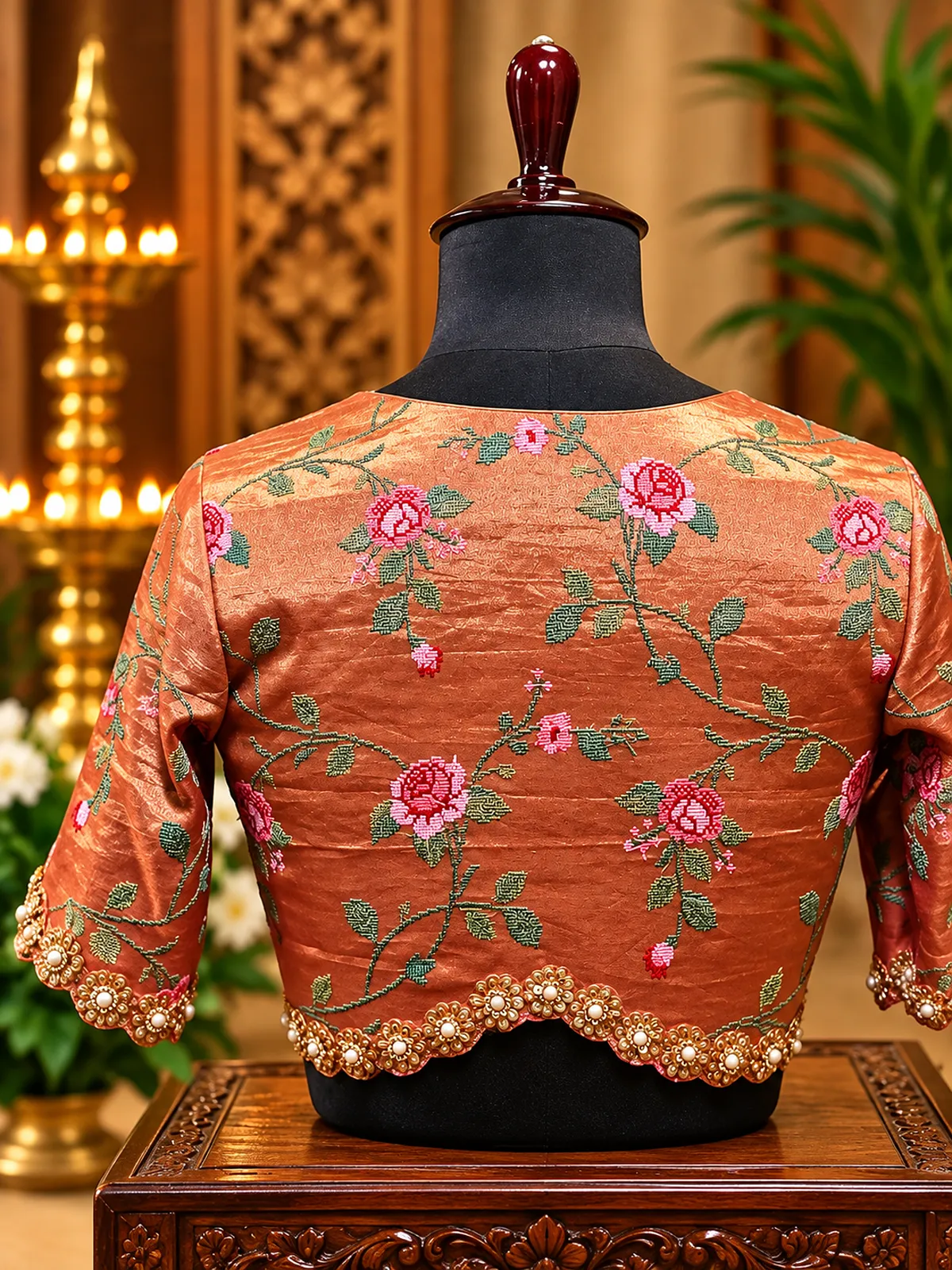 embroidered copper silk blouse on mannequin embroidered copper silk blouse on mannequin