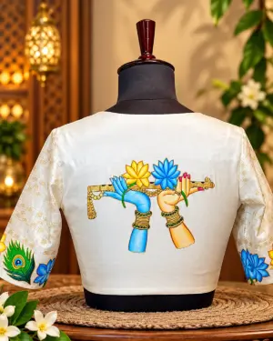 embroidered flute motif blouse in warm studio light