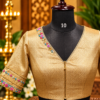 golden brocade blouse on mannequin golden brocade blouse on mannequin