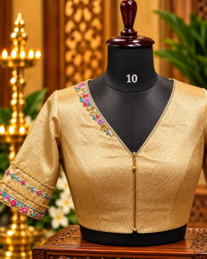 golden brocade blouse on mannequin