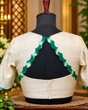 ivory blouse with emerald scalloped back