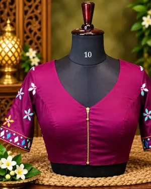 plum embroidered blouse on mannequin