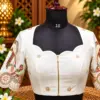 embroidered ivory blouse on mannequin embroidered ivory blouse on mannequin